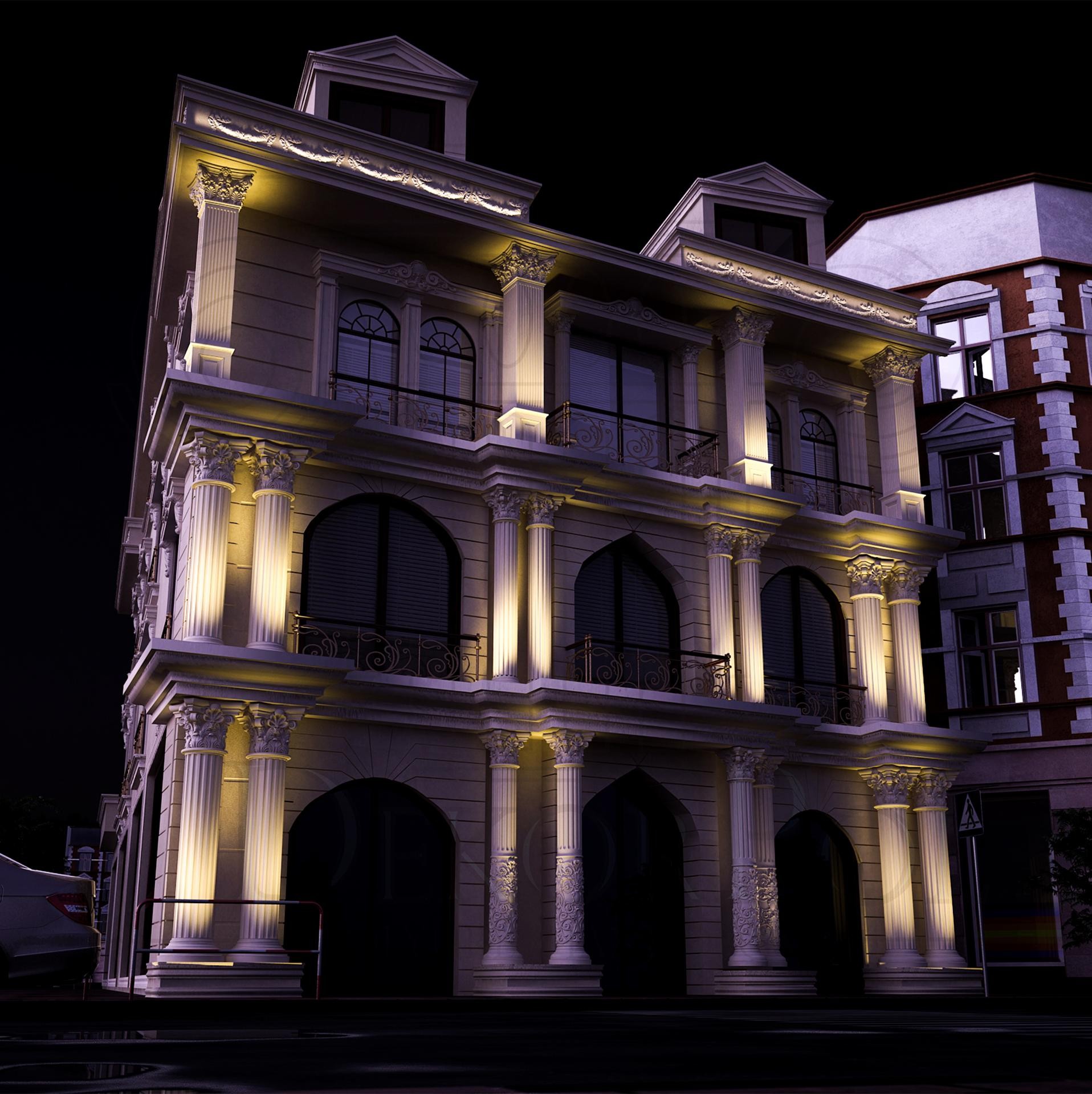 Geceleyin sıcak ışıklandırmalarla aydınlatılmış, büyük yivli poliüretan sütunlar ve kemerli pencerelere sahip neoklasik bina dış cephesi.