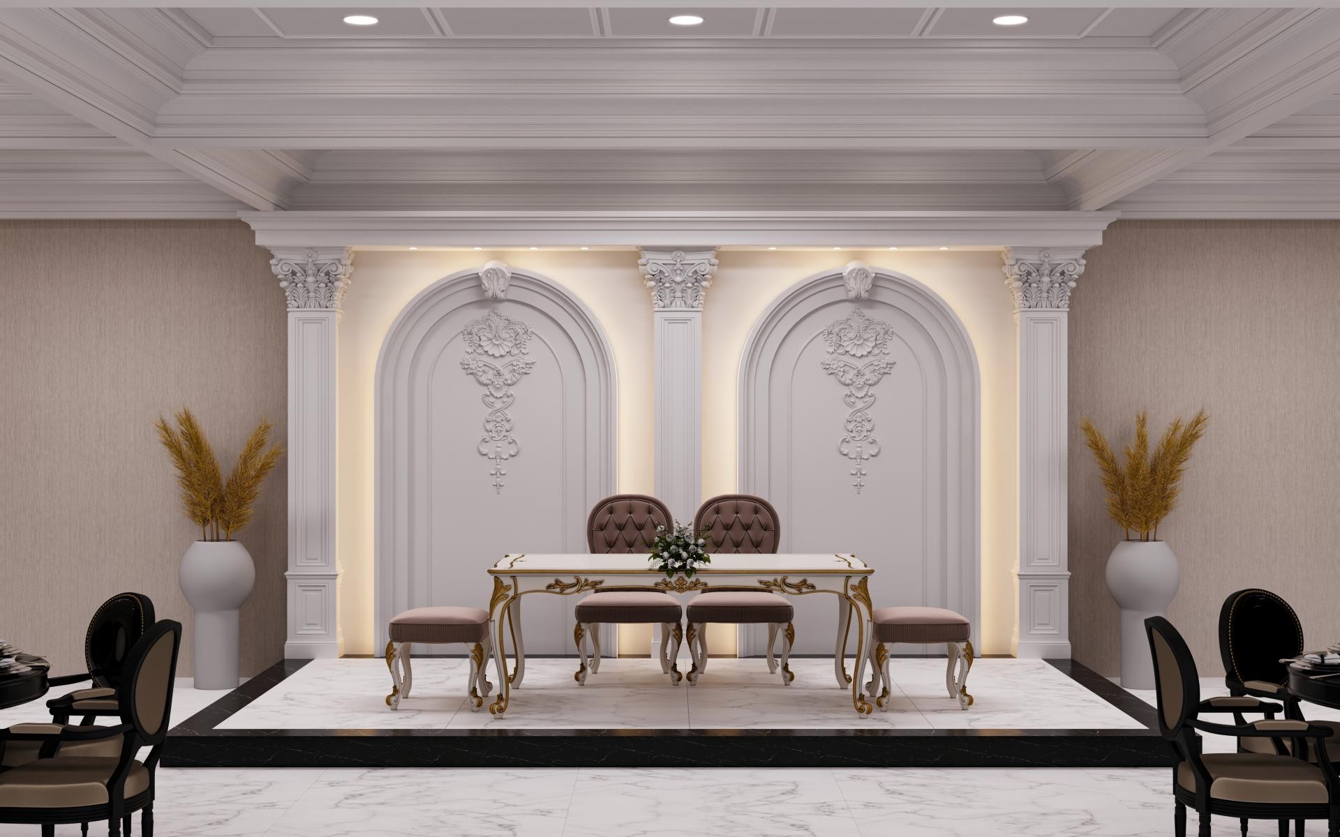 Arkadan aydınlatmalı iki adet kemerli duvar nişi, içlerinde desenli rölyefler, pilaster sütunlar ve önünde şık bir yemek masası bulunan iç mekan.