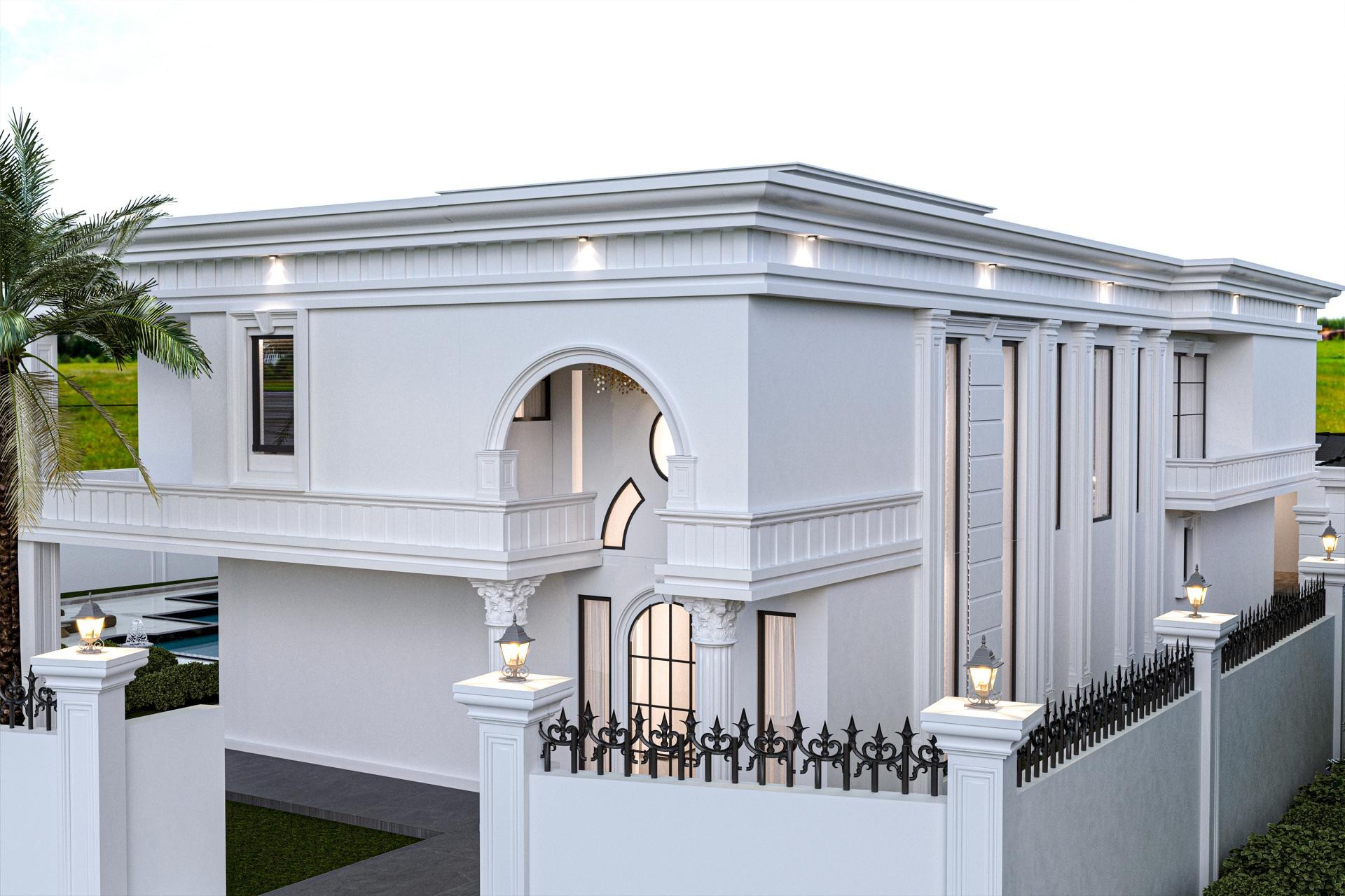 Geniş kavisli bir giriş kemerine, dikey pilaster sütunlara ve poliüretan pencere sövelerine sahip beyaz renkli iki katlı villa cephesi ve siyah bahçe çitleri.