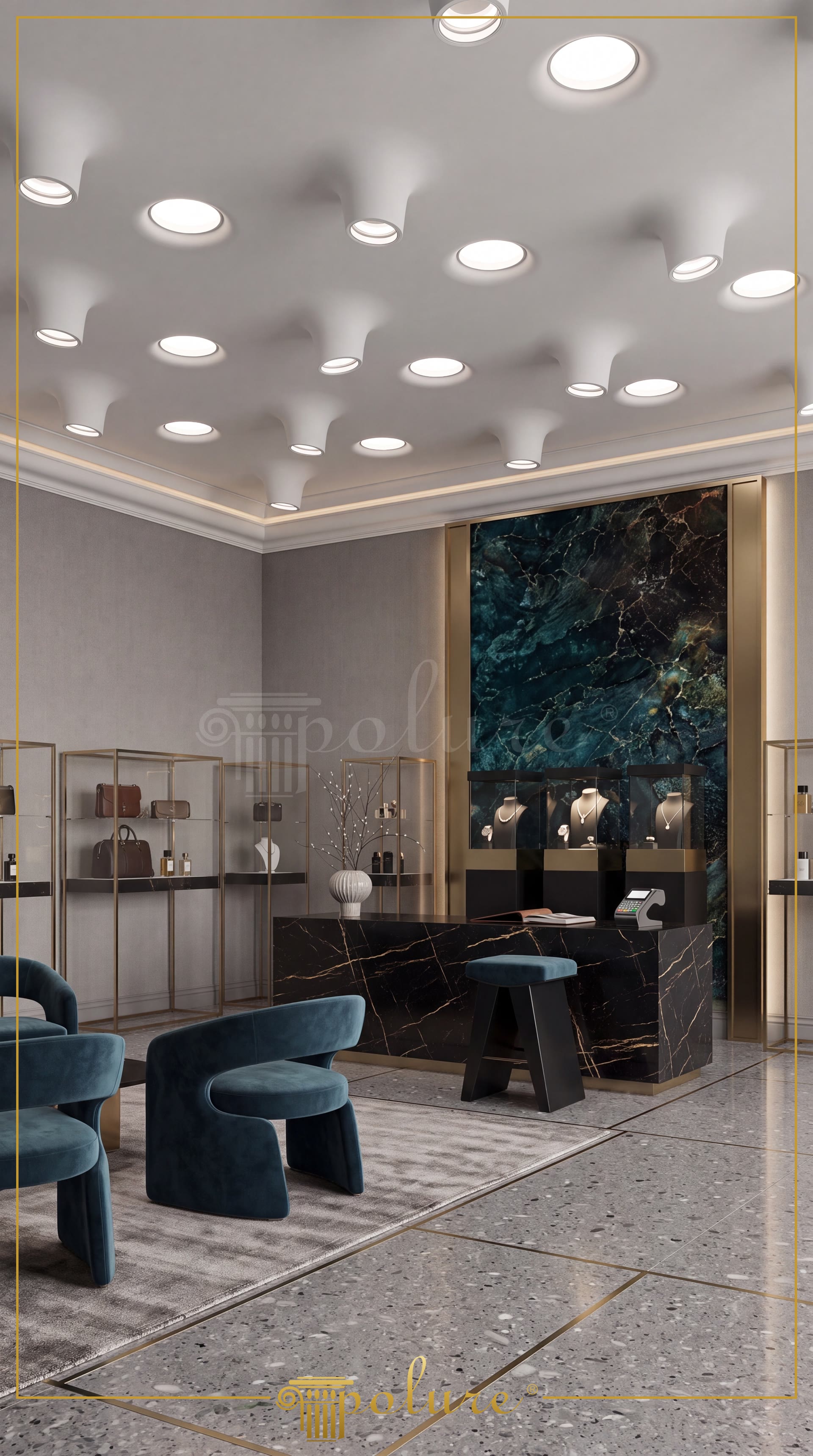 Yeşil mermer duvar vurgusu, siyah banko, gri duvarlar ve mavi kadife koltukların bulunduğu modern butik. Beyaz tavan, dairesel konik poliüretan spot kasalarıyla kaplı.