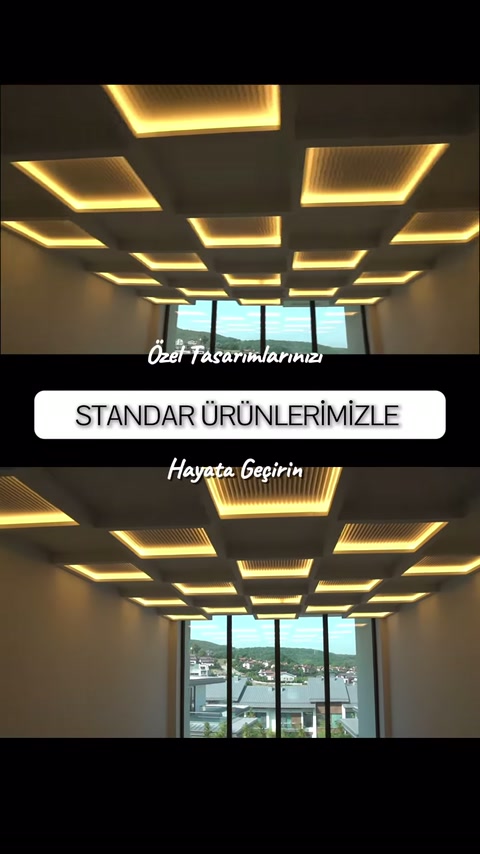 Farklı ölçülerdeki geometrik ışık çerçeveleri tavanda birlikte sergileniyor