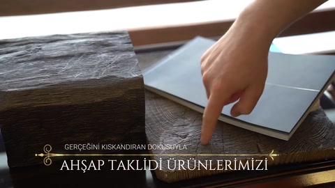 Dekoratif bant malzemesi kiriş yüzeyine elle hizalanıyor