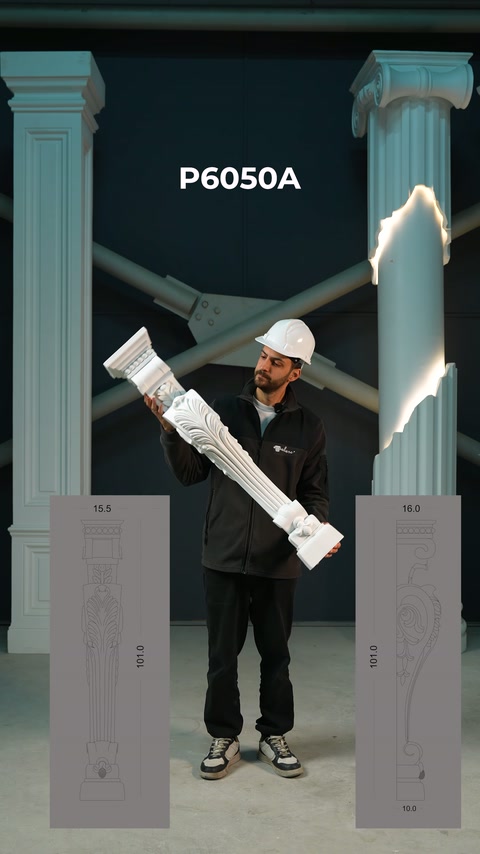 İşçi, uzun kabartmalı mimari elemanı dikey sütunlar arasında sergiliyor